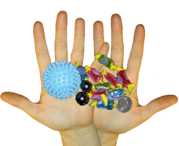 Hands holding candy, coin, and ball.